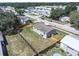 Overhead view of the home, its backyard with a wooden fence, and the community's layout at 3924 Kiah Dr, Wesley Chapel, FL 33543