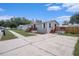 Property showcasing dual wood decks and steps, enhancing curb appeal and outdoor access at 3924 Kiah Dr, Wesley Chapel, FL 33543