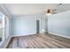 Inviting living room featuring a ceiling fan, lots of natural light, and easy access to other rooms at 3924 Kiah Dr, Wesley Chapel, FL 33543