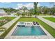 Aerial view of a backyard featuring a sparkling pool, spa, and well-manicured lawn at 4115 N Blvd, Tampa, FL 33603