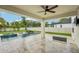 Covered backyard patio showcasing a pool, lounge seating, and a well-maintained outdoor space at 4115 N Blvd, Tampa, FL 33603