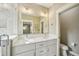 Bathroom featuring double vanity, quartz countertop, and glass shower at 4115 N Blvd, Tampa, FL 33603
