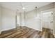 Bright bedroom features wood-look flooring, modern light fixtures, and a closet at 4115 N Blvd, Tampa, FL 33603