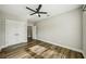 Bright bedroom features wood-look flooring, closet, and ceiling fan at 4115 N Blvd, Tampa, FL 33603