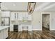 Dining and kitchen area with wine storage and designer lighting at 4115 N Blvd, Tampa, FL 33603