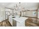 Bright kitchen featuring white cabinetry, quartz countertops, and stainless steel appliances at 4115 N Blvd, Tampa, FL 33603