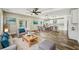 Open-concept living room and kitchen with modern finishes, hardwood floors, and ample natural light at 4115 N Blvd, Tampa, FL 33603