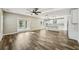 Open-concept living space featuring hardwood floors, natural light, and backyard access at 4115 N Blvd, Tampa, FL 33603