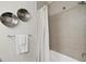 Bathroom featuring a shower with wood look tile surround and decorative tile accents at 4121 W San Nicholas St, Tampa, FL 33629