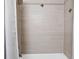 Bathtub and shower featuring wood look tile surround and decorative accents at 4121 W San Nicholas St, Tampa, FL 33629