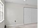Bedroom featuring a window and closet with bifold doors at 4121 W San Nicholas St, Tampa, FL 33629
