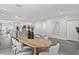 Open dining area featuring modern furniture, neutral colors, lots of natural light, and luxury vinyl plank flooring at 4121 W San Nicholas St, Tampa, FL 33629