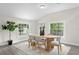 Inviting dining room with modern decor, a wooden table, and plenty of natural light at 4121 W San Nicholas St, Tampa, FL 33629