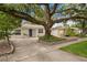 Attractive single story home featuring mature landscaping and a lovely shade tree at 4121 W San Nicholas St, Tampa, FL 33629