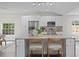Bright and open kitchen with an island, granite countertops, stainless steel appliances, and breakfast bar seating at 4121 W San Nicholas St, Tampa, FL 33629