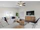 Well-lit living room with comfortable seating, a modern TV, and stylish decor at 4121 W San Nicholas St, Tampa, FL 33629