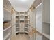 Walk-in closet featuring custom built-in shelving and ample storage space at 4121 W San Nicholas St, Tampa, FL 33629