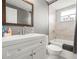 Bathroom features a shower and tub combo, single sink vanity and modern fixtures at 4150 Pecos Dr, New Port Richey, FL 34653