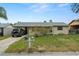 Charming single-story home with a well-maintained lawn and mature landscaping at 4150 Pecos Dr, New Port Richey, FL 34653