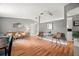 Open-concept living room showcasing hardwood floors, comfortable seating, and a modern design at 4150 Pecos Dr, New Port Richey, FL 34653