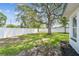 Expansive backyard featuring a large shade tree and a well-maintained lawn at 4461 Shore Acres Ne Blvd, St Petersburg, FL 33703