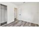 This bedroom features wood floors, a closet and white paint at 4461 Shore Acres Ne Blvd, St Petersburg, FL 33703
