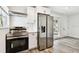 Updated kitchen with stainless steel appliances, including a range and refrigerator at 4461 Shore Acres Ne Blvd, St Petersburg, FL 33703