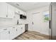 Bright, updated kitchen with white cabinets, quartz countertops, and stainless steel appliances at 4461 Shore Acres Ne Blvd, St Petersburg, FL 33703