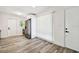 Bright kitchen featuring wood-look floors, white cabinetry, and modern stainless steel appliances at 4461 Shore Acres Ne Blvd, St Petersburg, FL 33703