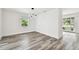 Open-concept living room with modern lighting and plenty of natural light at 4461 Shore Acres Ne Blvd, St Petersburg, FL 33703