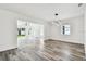 Spacious living room featuring an open layout and modern lighting fixture at 4461 Shore Acres Ne Blvd, St Petersburg, FL 33703