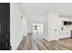 Bright, freshly renovated living area with new floors flowing to a modern, updated kitchen at 4461 Shore Acres Ne Blvd, St Petersburg, FL 33703
