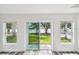 Patio with sliding glass doors provides outdoor access and natural light at 4461 Shore Acres Ne Blvd, St Petersburg, FL 33703