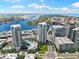 Expansive aerial shot showcasing luxury high-rises, a scenic river, and city skyline under a bright sky at 449 S 12Th St # 1201, Tampa, FL 33602