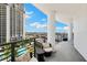 Expansive balcony overlooking a pool and city, with stylish seating at 449 S 12Th St # 1201, Tampa, FL 33602