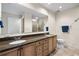 Spacious bathroom featuring double sinks, granite countertop, and a glass-enclosed shower at 449 S 12Th St # 1201, Tampa, FL 33602