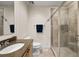 Bright bathroom with granite countertop vanity and tiled glass shower enclosure at 449 S 12Th St # 1201, Tampa, FL 33602