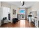 Bright bedroom featuring a work space, wood floors, and city views at 449 S 12Th St # 1201, Tampa, FL 33602
