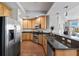 Kitchen with granite countertops, stainless steel appliances, and wood cabinetry at 449 S 12Th St # 1201, Tampa, FL 33602