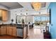 Open-concept kitchen and living area with hardwood floors, modern appliances, and city views at 449 S 12Th St # 1201, Tampa, FL 33602