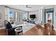 Cozy living room featuring hardwood floors, stylish furnishings and expansive windows offering scenic city views at 449 S 12Th St # 1201, Tampa, FL 33602