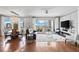 Bright living room with hardwood floors, floor-to-ceiling windows and stunning city views at 449 S 12Th St # 1201, Tampa, FL 33602