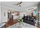 Open concept living room featuring hardwood floors, a modern ceiling fan, and a comfortable leather sofa at 449 S 12Th St # 1201, Tampa, FL 33602