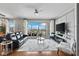 Chic living room with hardwood floors, modern decor, and expansive windows showcasing stunning city views at 449 S 12Th St # 1201, Tampa, FL 33602