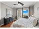 Cozy main bedroom featuring hardwood floors, neutral walls, and balcony with scenic views at 449 S 12Th St # 1201, Tampa, FL 33602