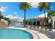Resort-style pool with waterfall feature, lounge chairs, and lush landscaping for a relaxing outdoor experience at 449 S 12Th St # 1201, Tampa, FL 33602