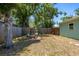 Spacious backyard with lush greenery and seating area, great for outdoor relaxation and entertainment at 4531 7Th N Ave, St Petersburg, FL 33713