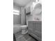 Modern bathroom featuring grey tiled flooring and vanity with storage space at 4531 7Th N Ave, St Petersburg, FL 33713