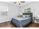 Stylish bedroom with dark hardwood floors, natural lighting, and side tables at 4531 7Th N Ave, St Petersburg, FL 33713