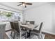Inviting dining room featuring a wood table, upholstered chairs, and bright natural light from the window at 4531 7Th N Ave, St Petersburg, FL 33713